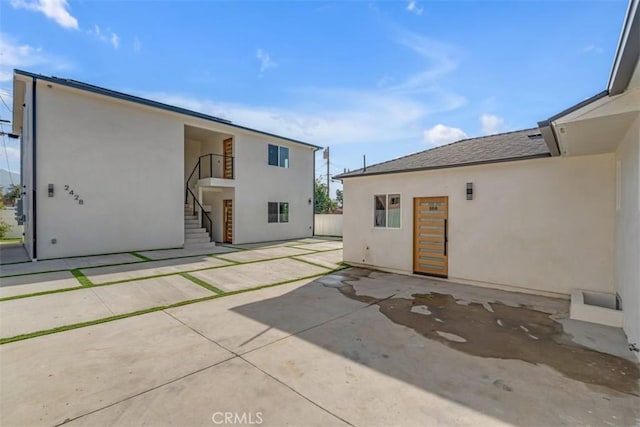 back of property with a patio area