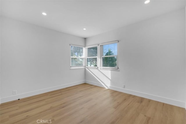 unfurnished room featuring light hardwood / wood-style flooring