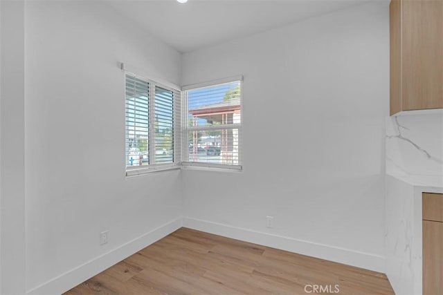 unfurnished room featuring light hardwood / wood-style flooring