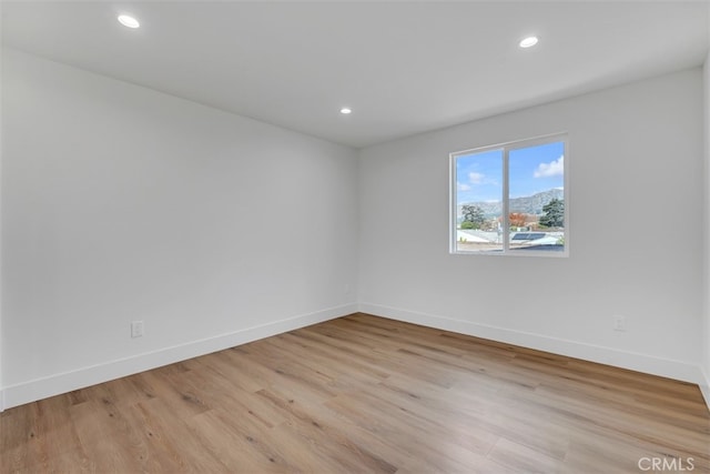 unfurnished room featuring light hardwood / wood-style flooring