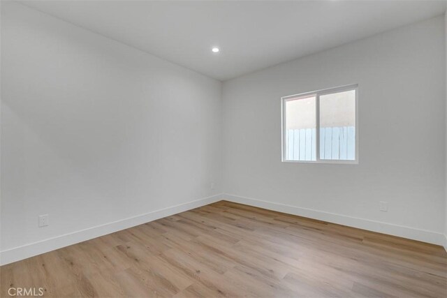 spare room featuring light hardwood / wood-style flooring