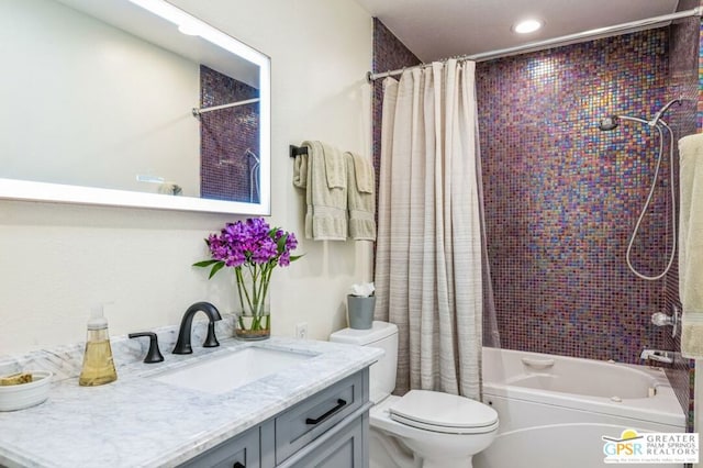 full bathroom with toilet, vanity, and shower / bath combo with shower curtain