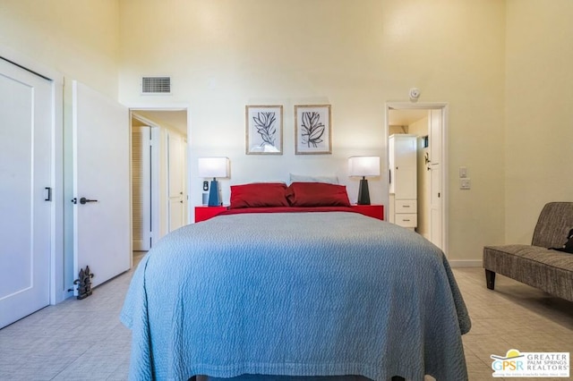 bedroom featuring a high ceiling