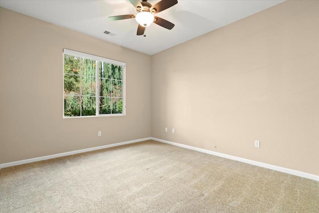 carpeted empty room with ceiling fan