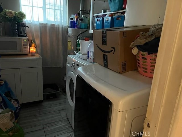 laundry area featuring independent washer and dryer