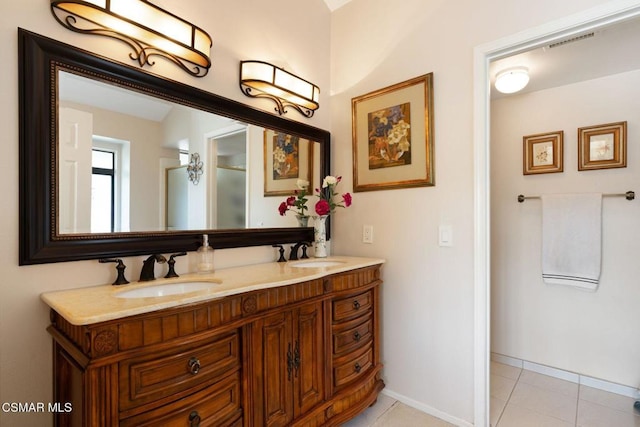 bathroom featuring tile patterned floors and vanity