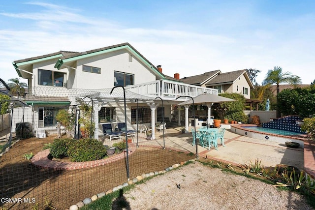 rear view of house featuring a patio area