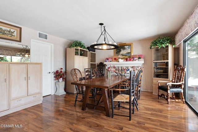 dining area with dark hardwood / wood-style floors