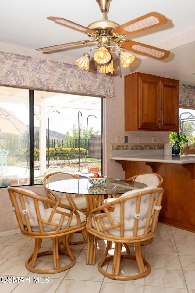 dining space featuring ceiling fan