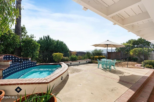 view of swimming pool with an in ground hot tub and a patio area