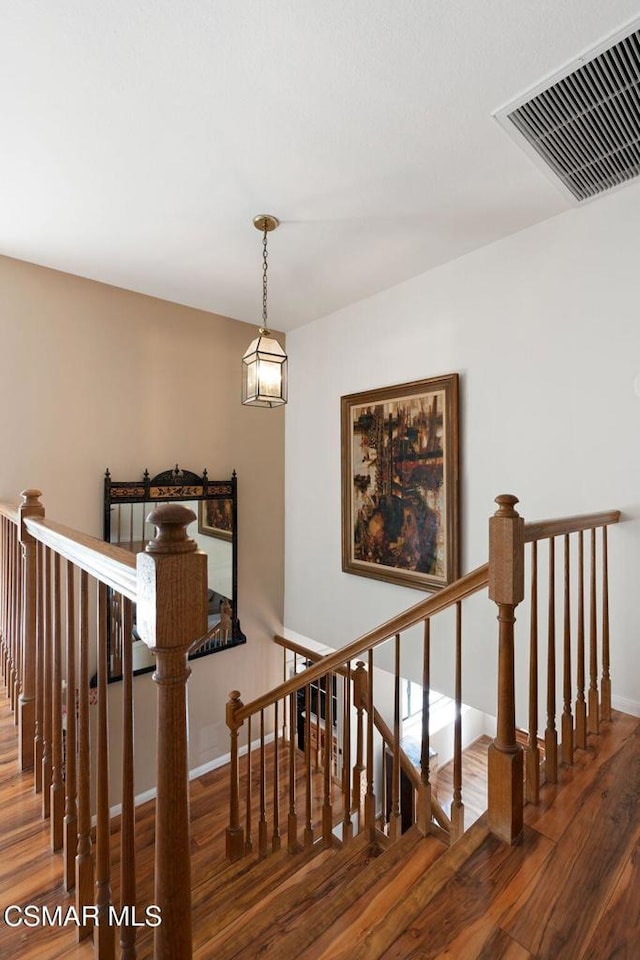 stairway with wood-type flooring