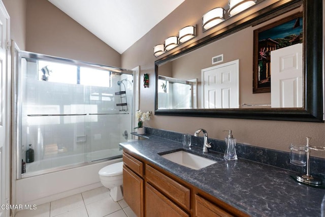 full bathroom featuring toilet, bath / shower combo with glass door, lofted ceiling, tile patterned floors, and vanity