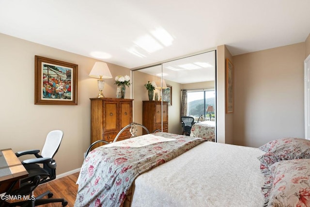 bedroom featuring a closet and hardwood / wood-style flooring