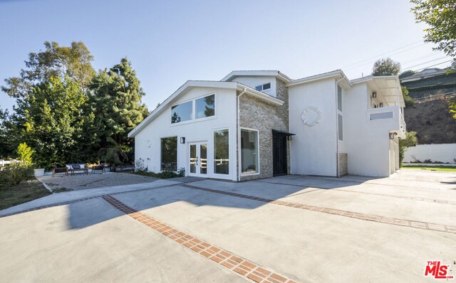 view of front of property featuring french doors and a patio