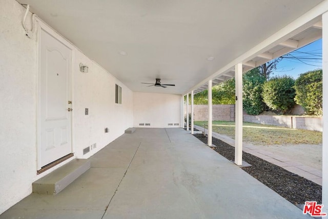 view of patio featuring ceiling fan