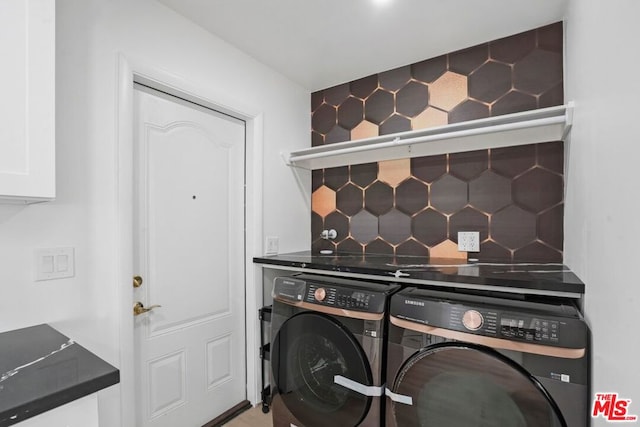 laundry area featuring washing machine and dryer