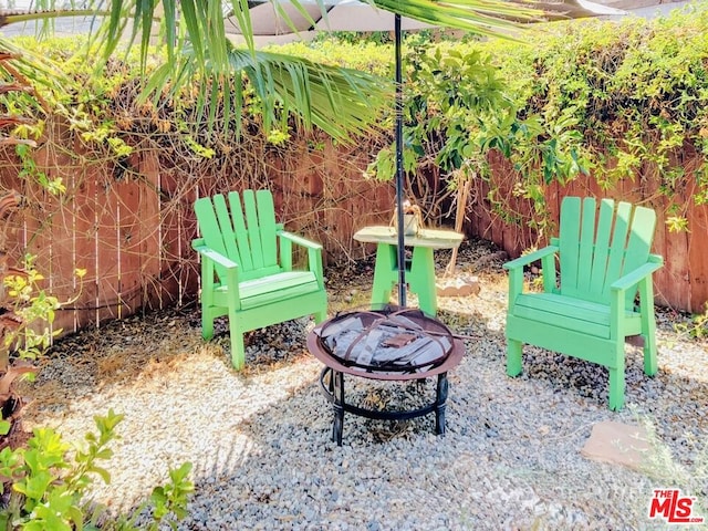 view of patio with a fire pit