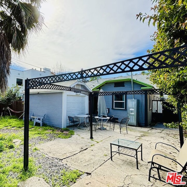 exterior space featuring a garage and an outdoor structure