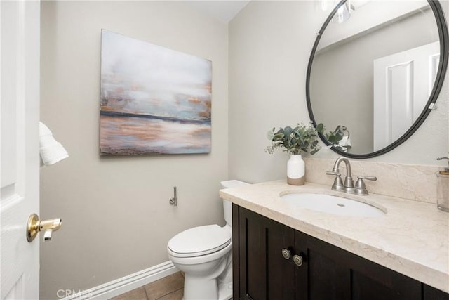 bathroom with tile patterned floors, vanity, and toilet