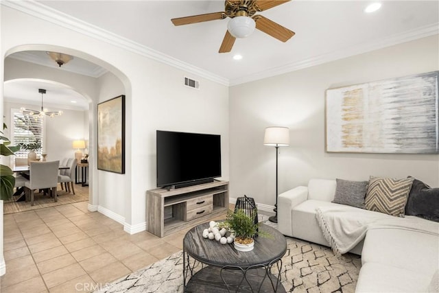 living room featuring ceiling fan, light tile patterned floors, and ornamental molding