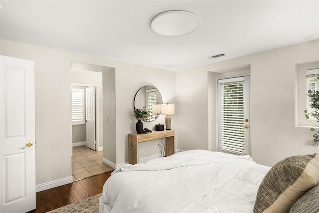 bedroom with hardwood / wood-style floors