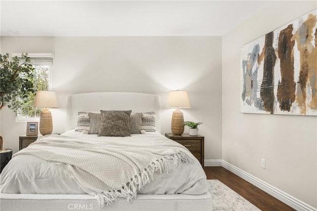 bedroom featuring dark wood-type flooring