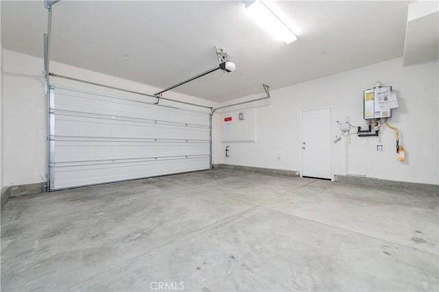 garage featuring water heater and a garage door opener