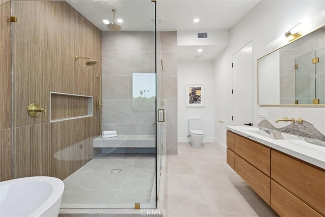 full bathroom with toilet, vanity, separate shower and tub, and tile patterned flooring