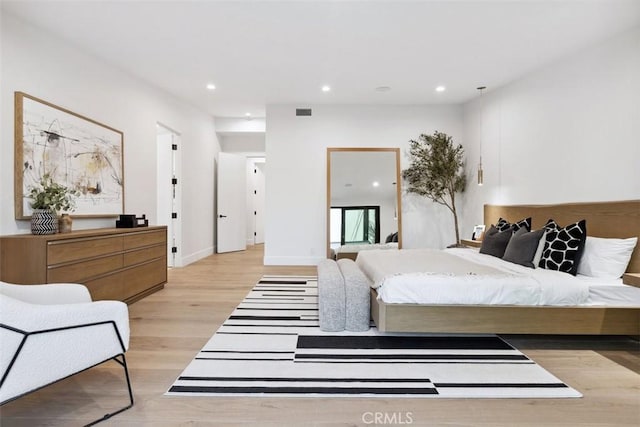 bedroom with light hardwood / wood-style flooring