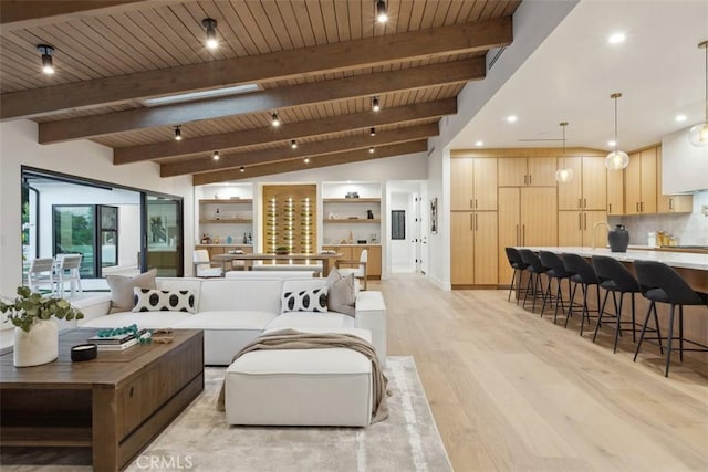 living room with wooden ceiling, light hardwood / wood-style flooring, and vaulted ceiling with beams