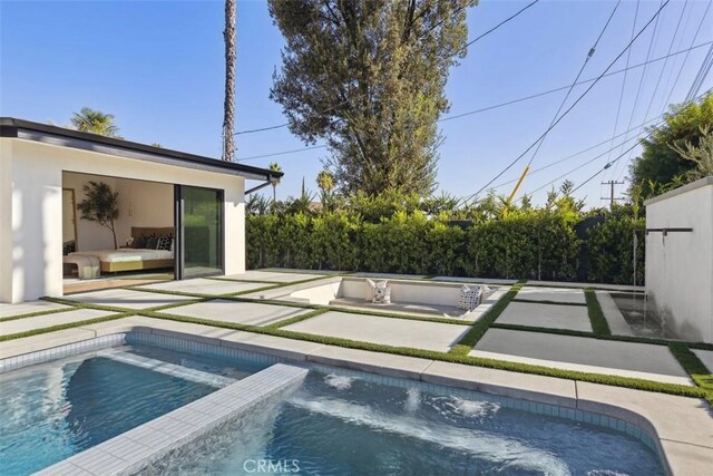 view of swimming pool with a patio area