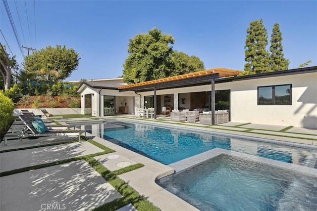 view of pool featuring an outdoor hangout area, a patio area, and an in ground hot tub