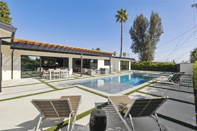 view of pool featuring a patio area