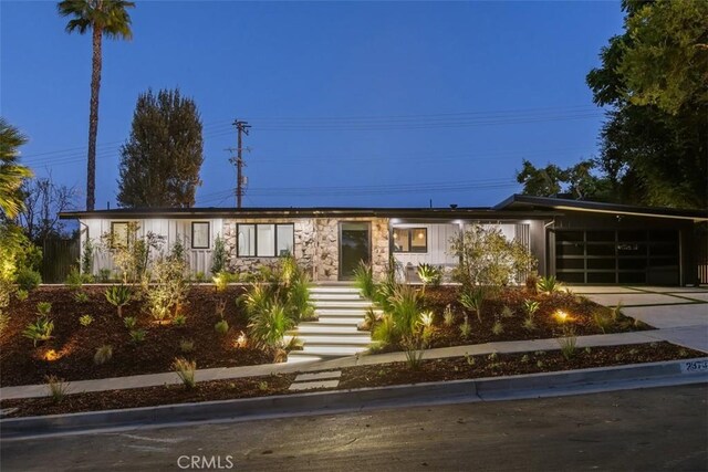 ranch-style house featuring a carport