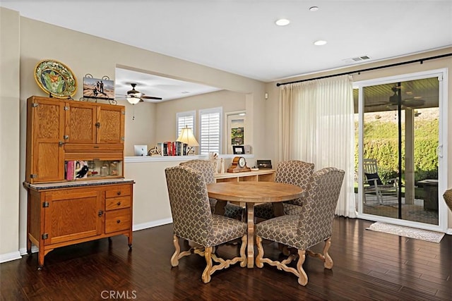 dining space featuring ceiling fan and dark hardwood / wood-style floors