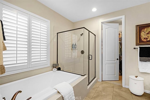 bathroom featuring tile patterned floors and plus walk in shower