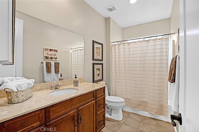 full bathroom featuring vanity, shower / bath combo, tile patterned floors, and toilet