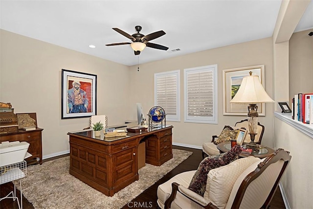 home office with hardwood / wood-style flooring and ceiling fan