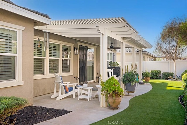 view of patio / terrace featuring ceiling fan and a pergola