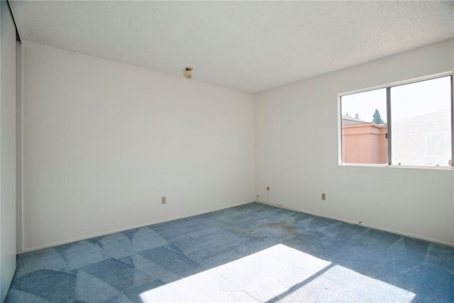 empty room featuring carpet floors