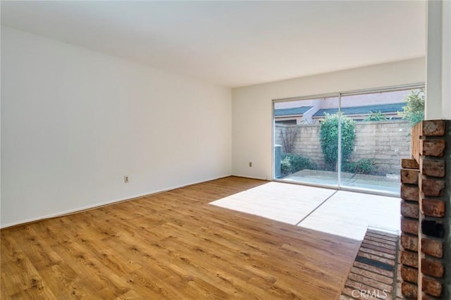 unfurnished living room with hardwood / wood-style floors