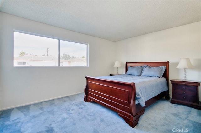 bedroom featuring light colored carpet