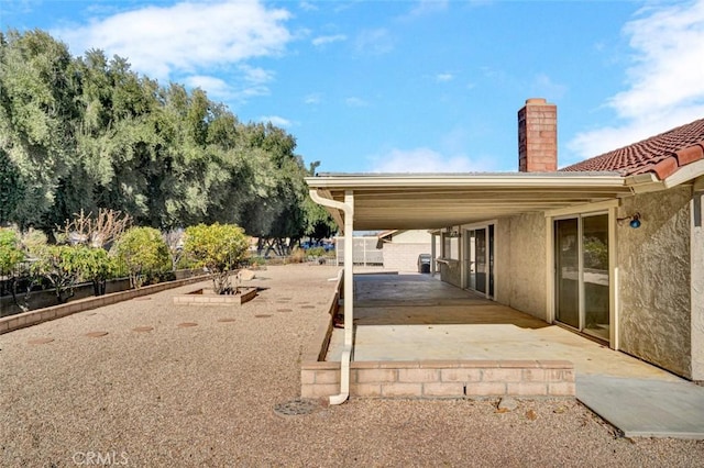 view of yard with fence and a patio area