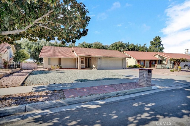 ranch-style house featuring a garage