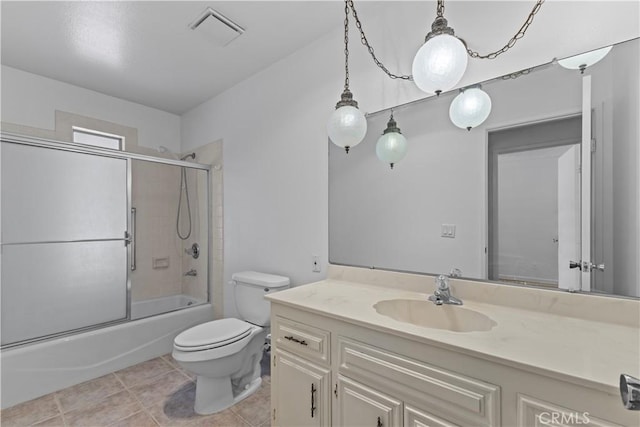 full bath with shower / bath combination with glass door, visible vents, toilet, tile patterned floors, and vanity