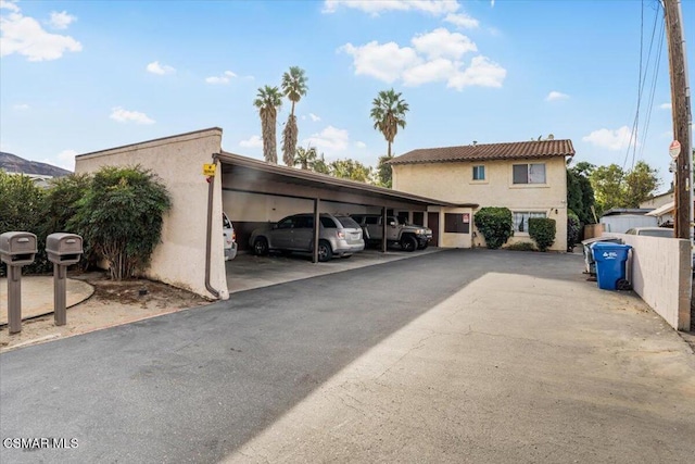 view of parking featuring a carport