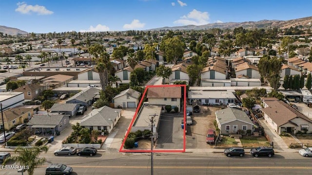 birds eye view of property featuring a mountain view