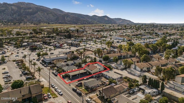 birds eye view of property featuring a mountain view