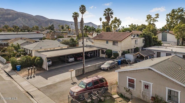 birds eye view of property featuring a mountain view