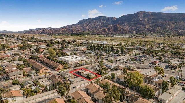 birds eye view of property featuring a mountain view